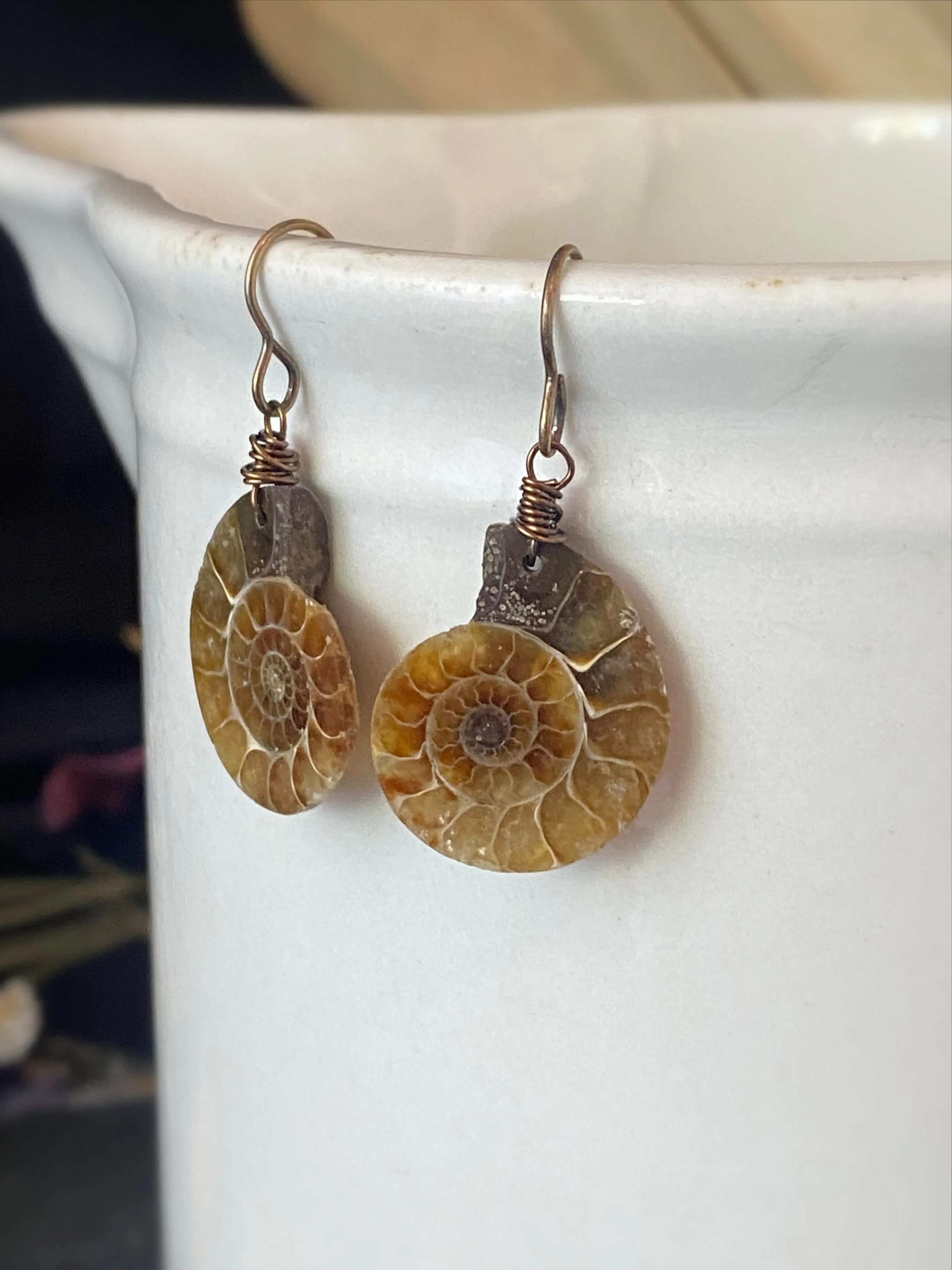 Ammonite stone, bronze metal earrings, jewelry.